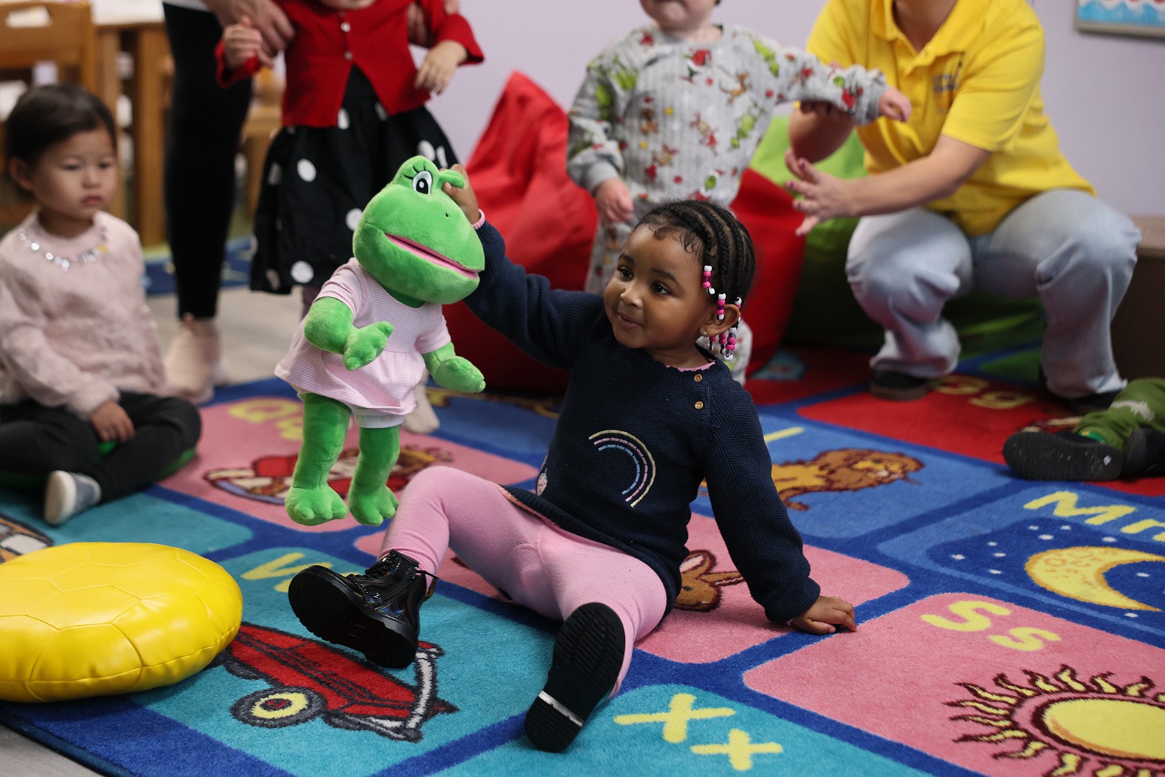 Preschool students in New York City play with toys.